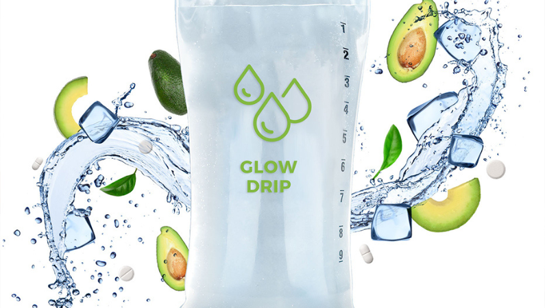 Multi vitamin drip surrounded by vegetables