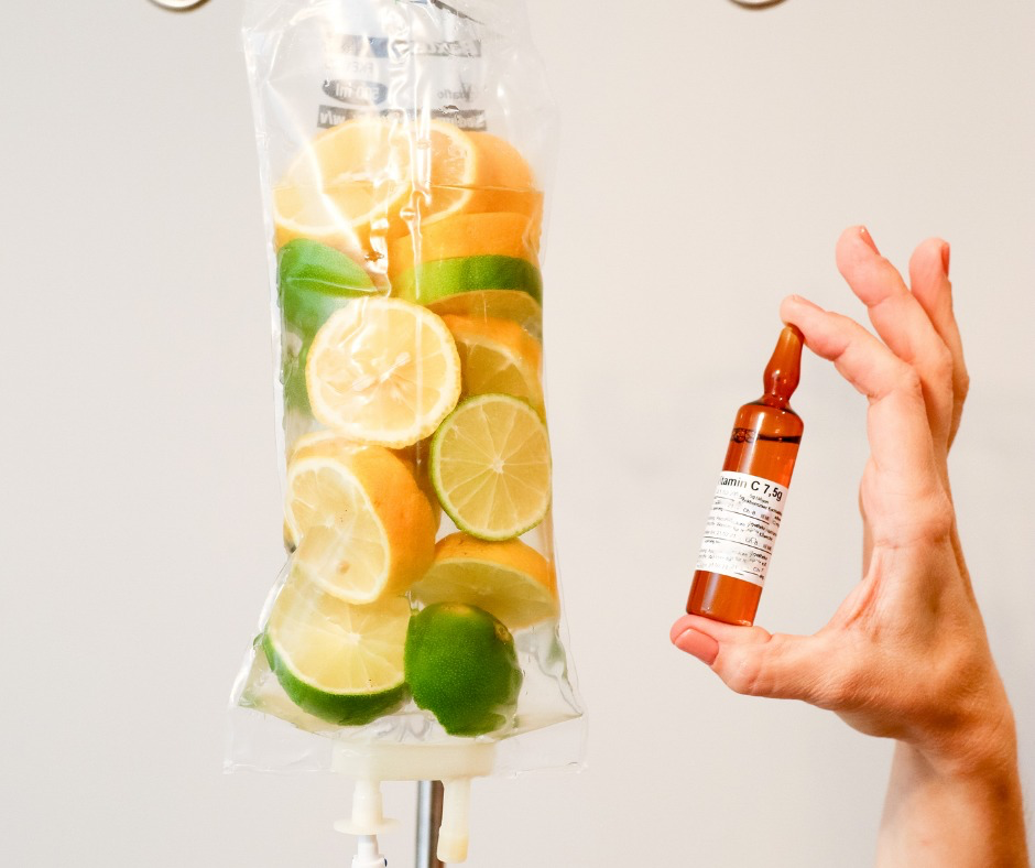 Detox vitamin drip surrounded by berries and lemon